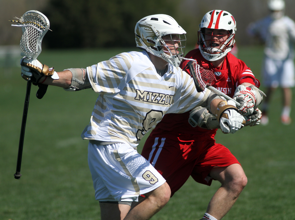 Zach Nisson works against a Wisconsin defender. Nisson leads the team with nearly 3.5 goals per game. 
